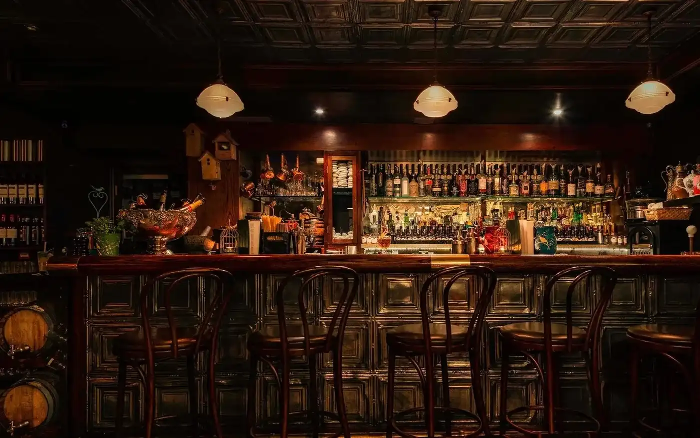 Tin-panelled bar front with bentwood stools at Nightjar in Shoreditch, London