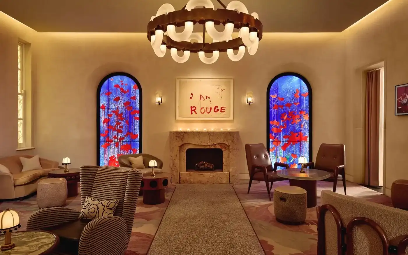 The Red Room at The Connaught in Mayfair with stained-glass windows and a marble fireplace