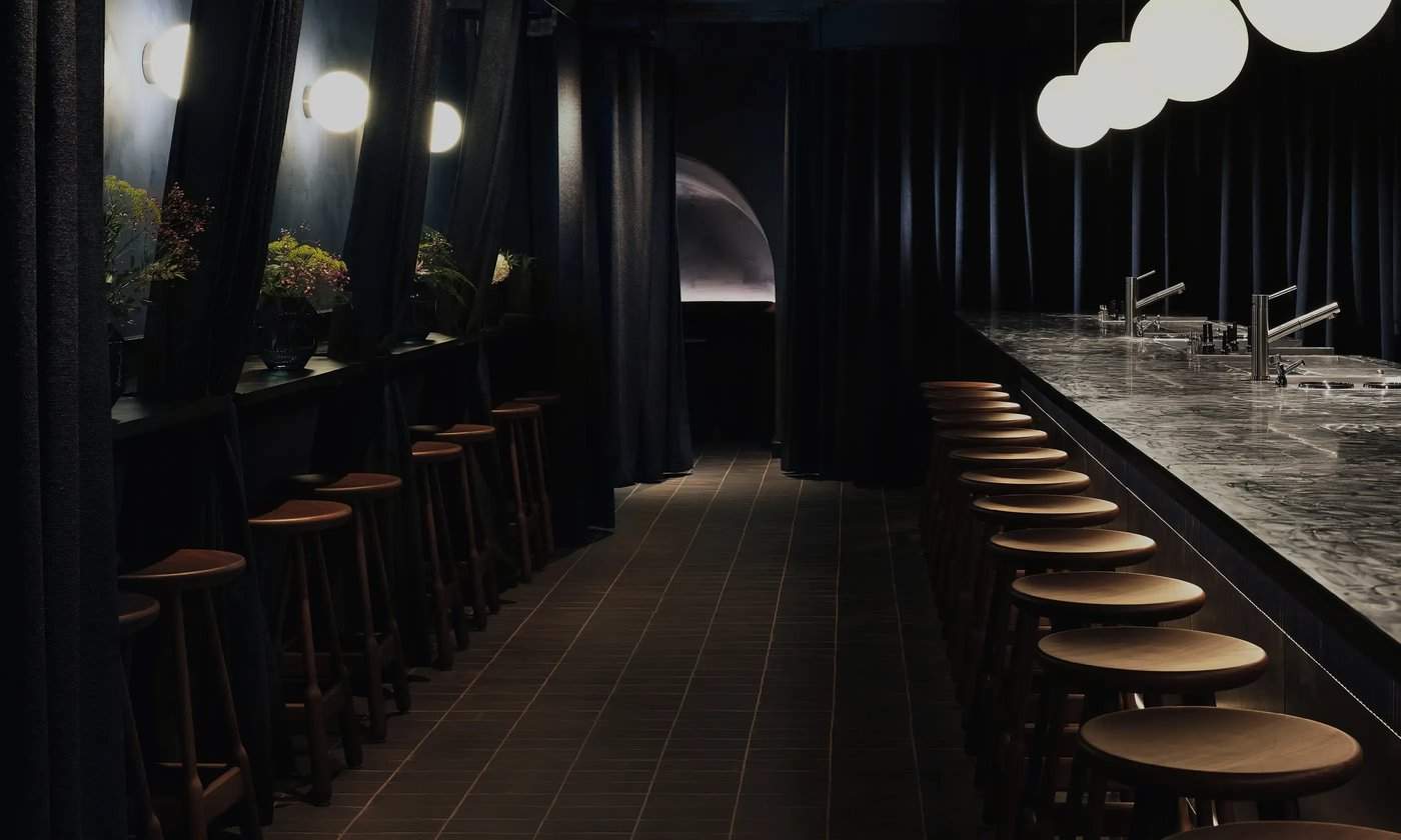SOMA cocktail bar interior with stainless steel bar in Soho, London