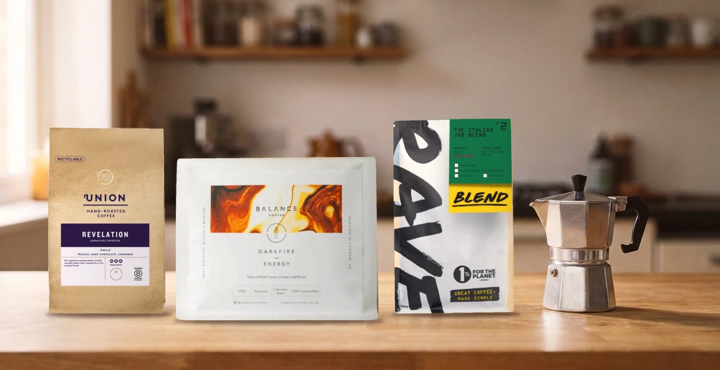 Union Revelation, Balance Coffee Darkfire Energy and Rave Italian Job coffee bags beside a stovetop moka pot