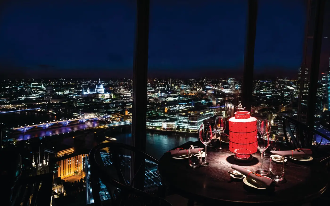Hutong at The Shard dining table with London skyline view at night, London Bridge