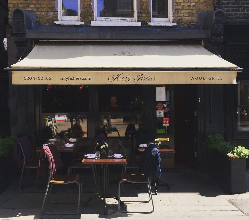 Kitty Fisher's intimate candlelit dining room in Shepherd Market, Mayfair, London