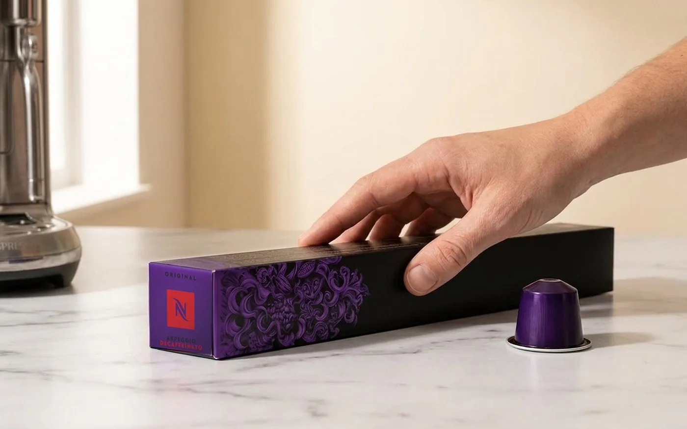 Nespresso Original Ispirazione Firenze Arpeggio Decaffeinato capsule sleeve with a purple Nespresso capsule