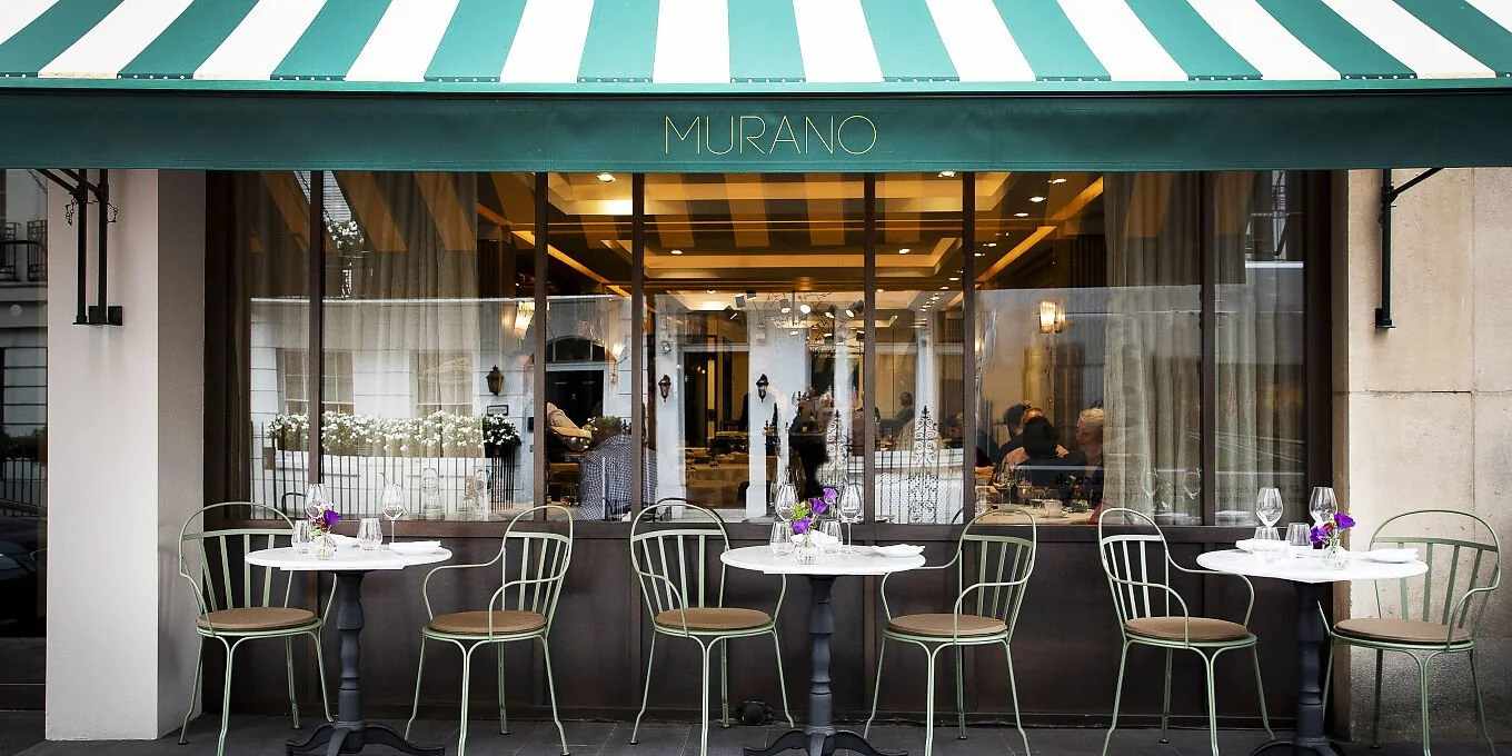 Murano restaurant exterior with outdoor tables, modern Italian dining in Mayfair, London