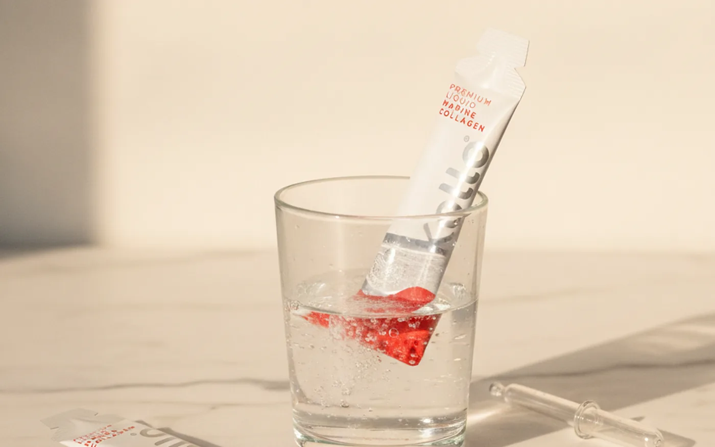 Collagen bioavailability: liquid versus powder sachets on marble surface
