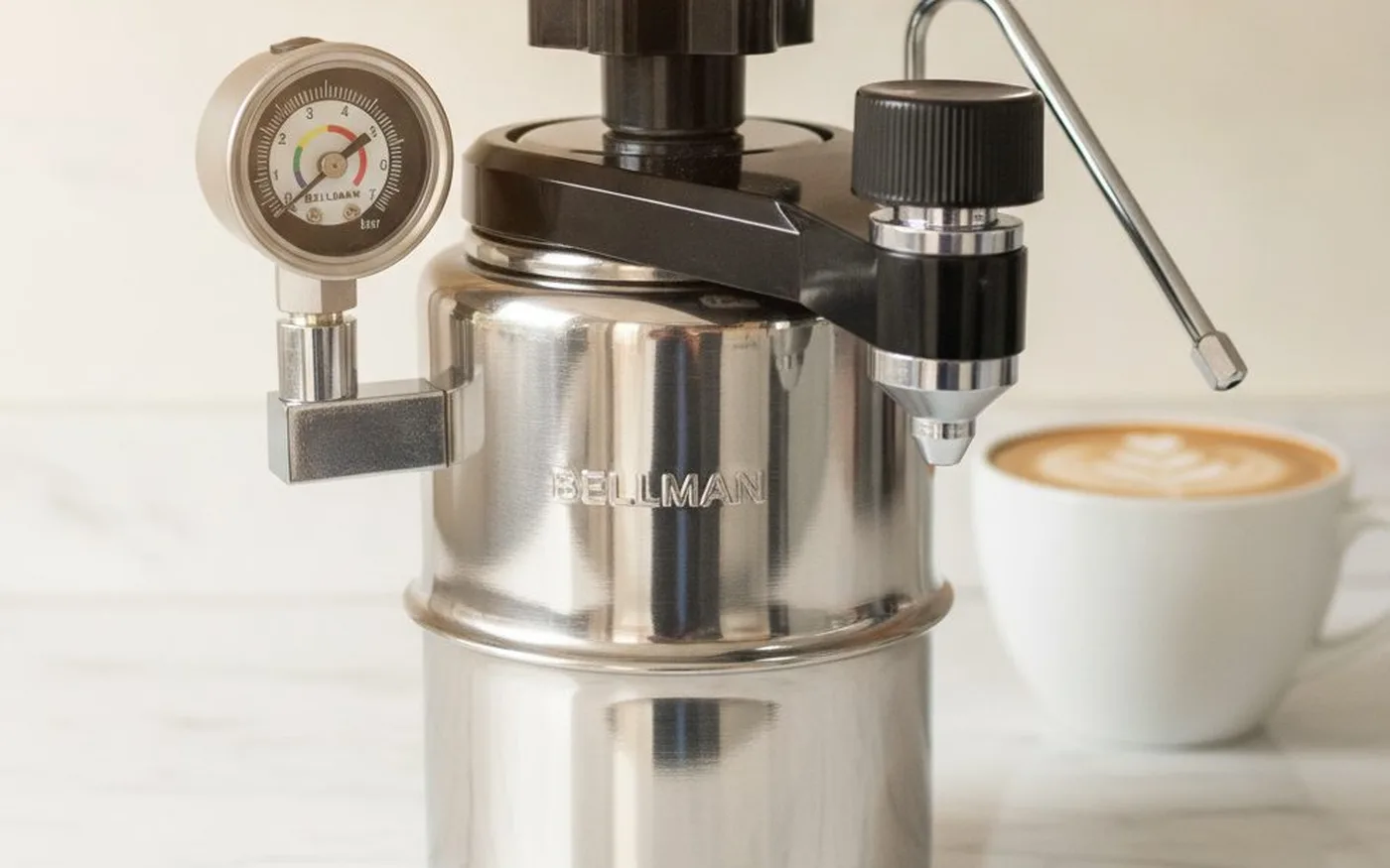 Bellman CX-25P stovetop pressure brewer on gas hob showing the pressure gauge and steam wand attachment