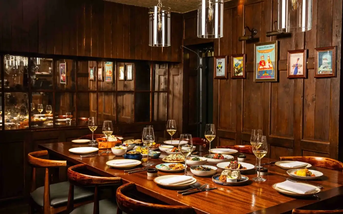 Trishna private dining room in dark wood panelling, Marylebone, London