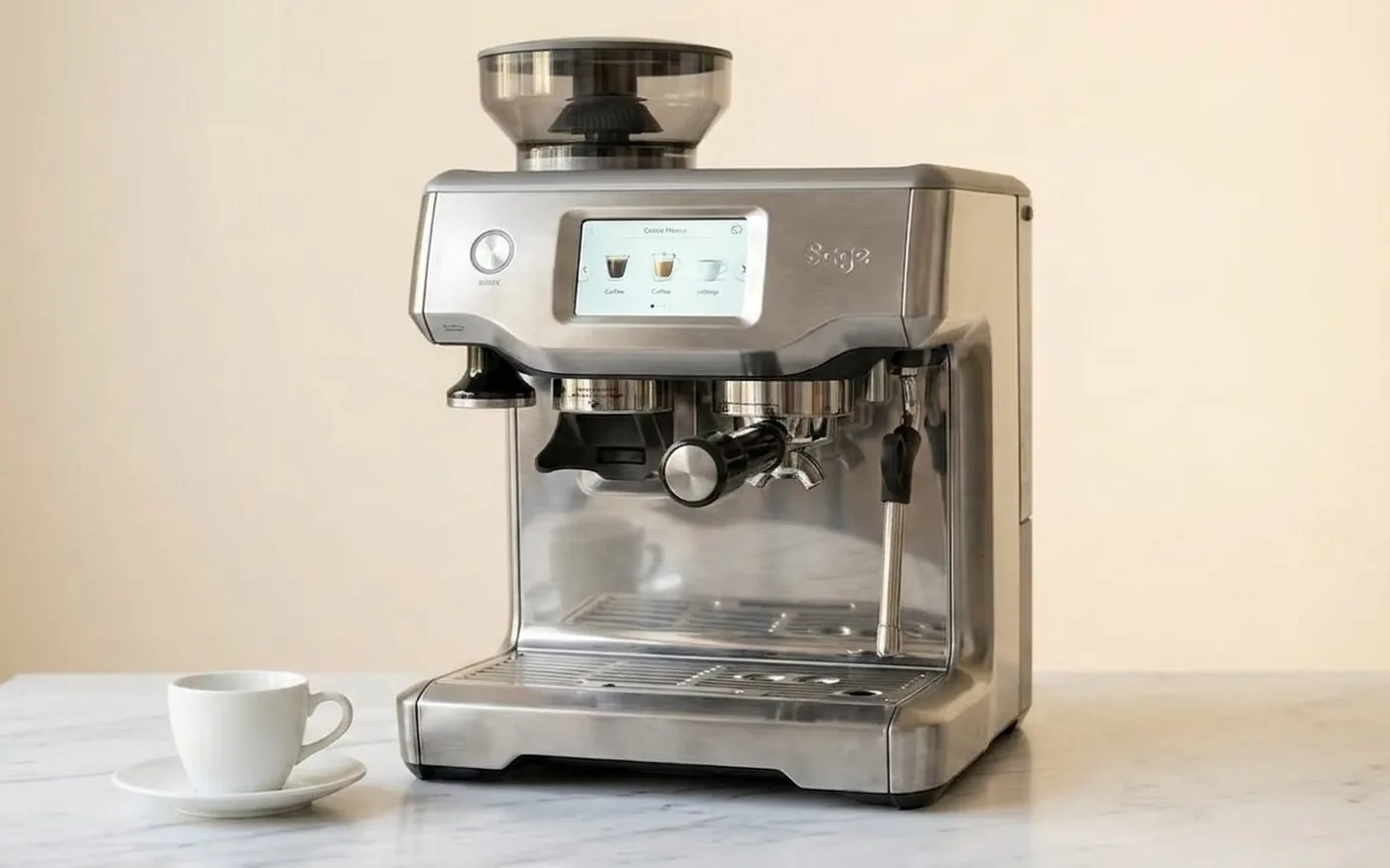 Sage Barista Touch touchscreen espresso machine with integrated grinder on white marble kitchen counter
