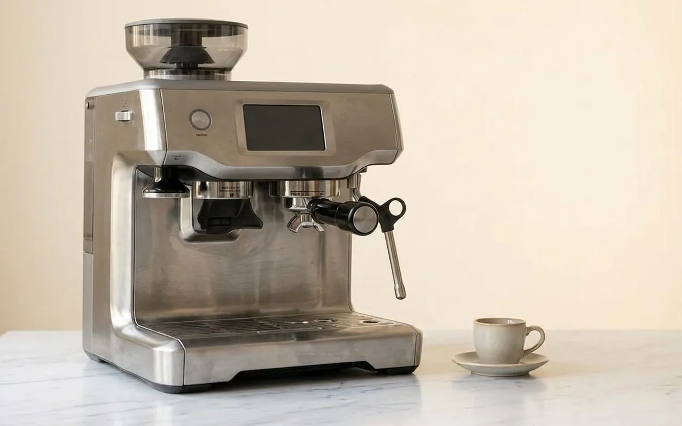 Sage Oracle automated espresso machine with auto-grinding and tamping on white marble kitchen counter