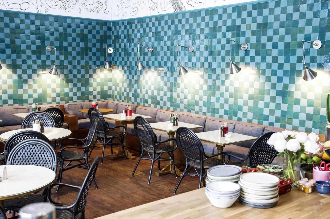 Farm Girl cafe interior with whitewashed walls and plant-filled decor, Notting Hill, London