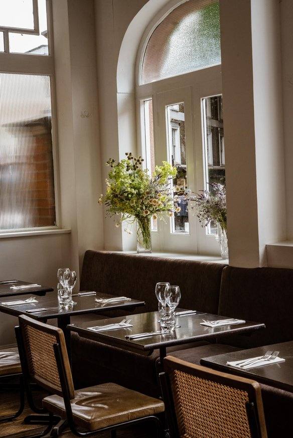 The Gate restaurant interior with arched windows, vegetarian dining in Marylebone, London