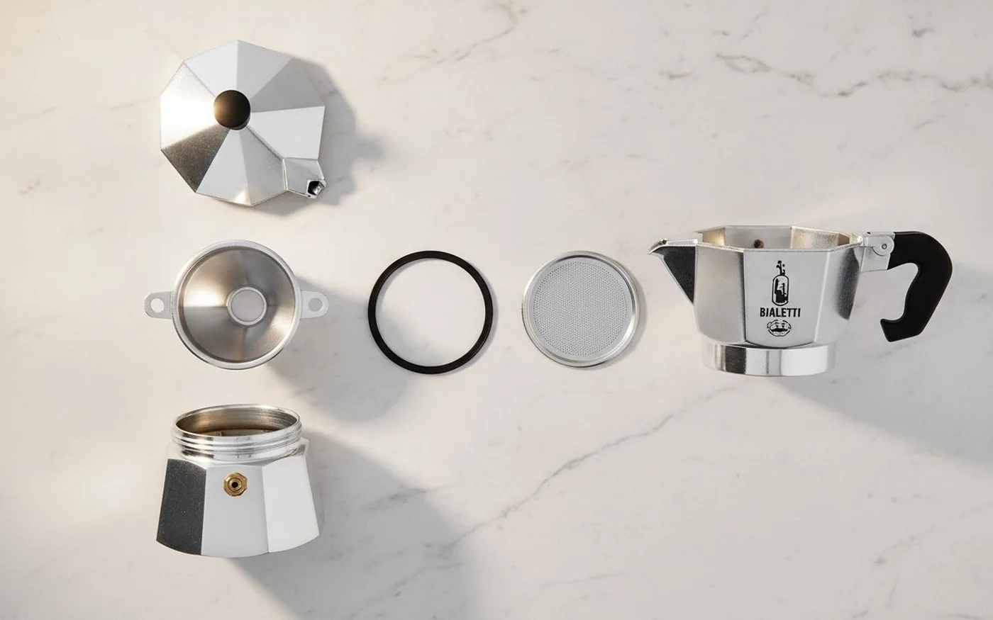 Bialetti Moka Express disassembled showing all parts
