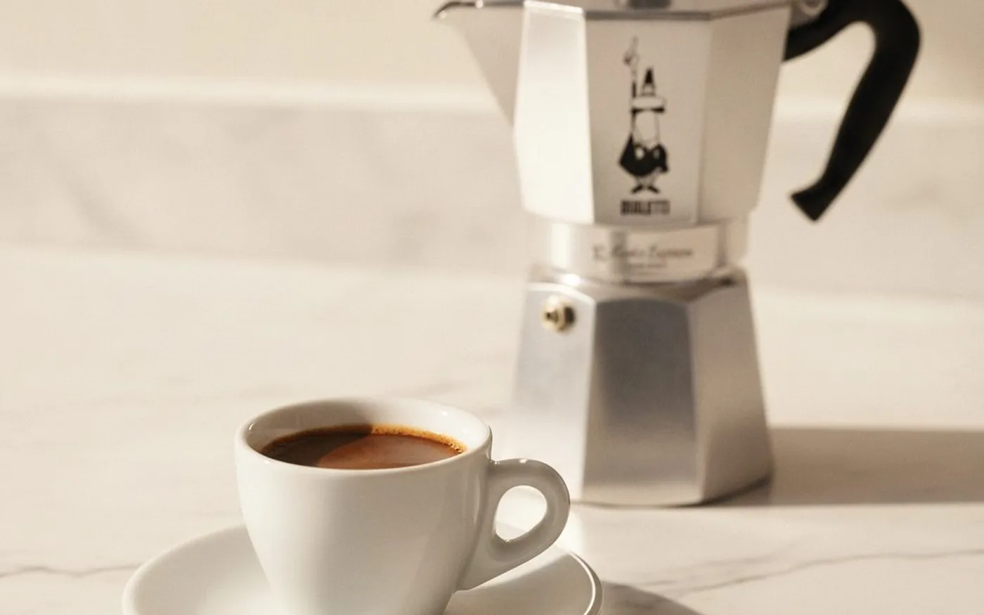 Strong concentrated moka pot coffee in small espresso cup