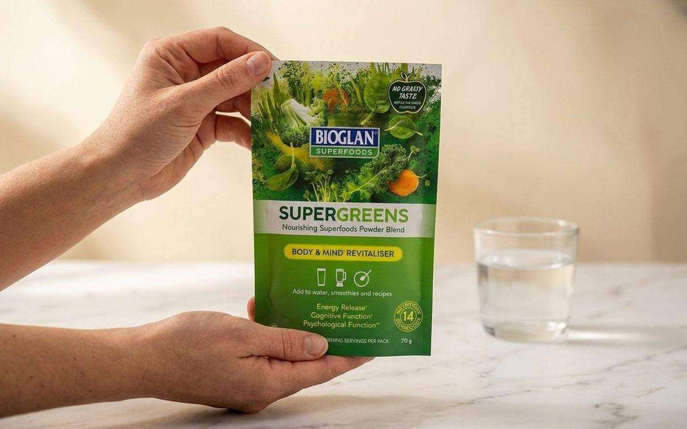 Bioglan Supergreens 70g pack and powder showing the mulled apple flavour