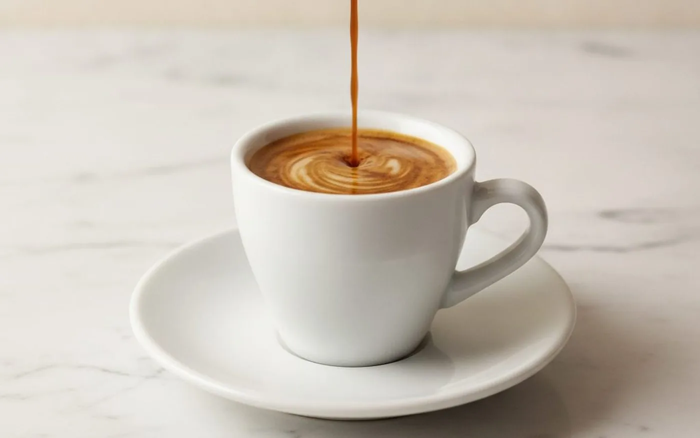 Espresso cup pour close up