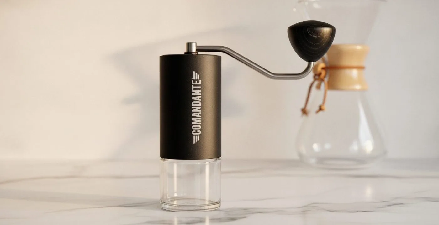 Comandante C40 MK4 hand coffee grinder in natural beech wood, on a white surface