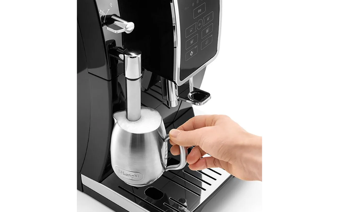 De'Longhi Dinamica steam wand frothing milk in a stainless steel jug