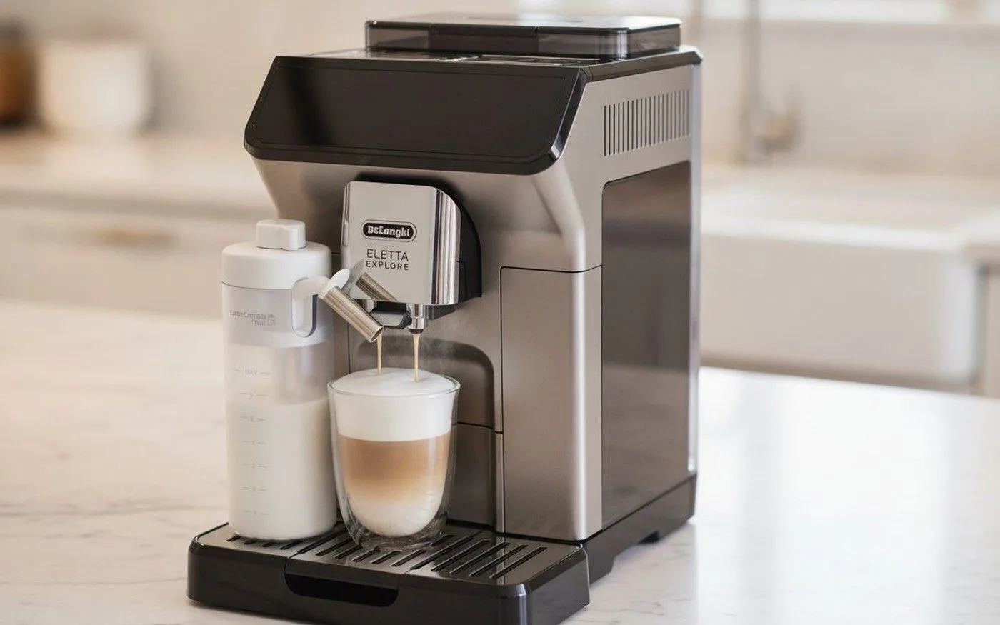 De'Longhi Eletta Explore being used to prepare a hot espresso-based drink, mid-brew