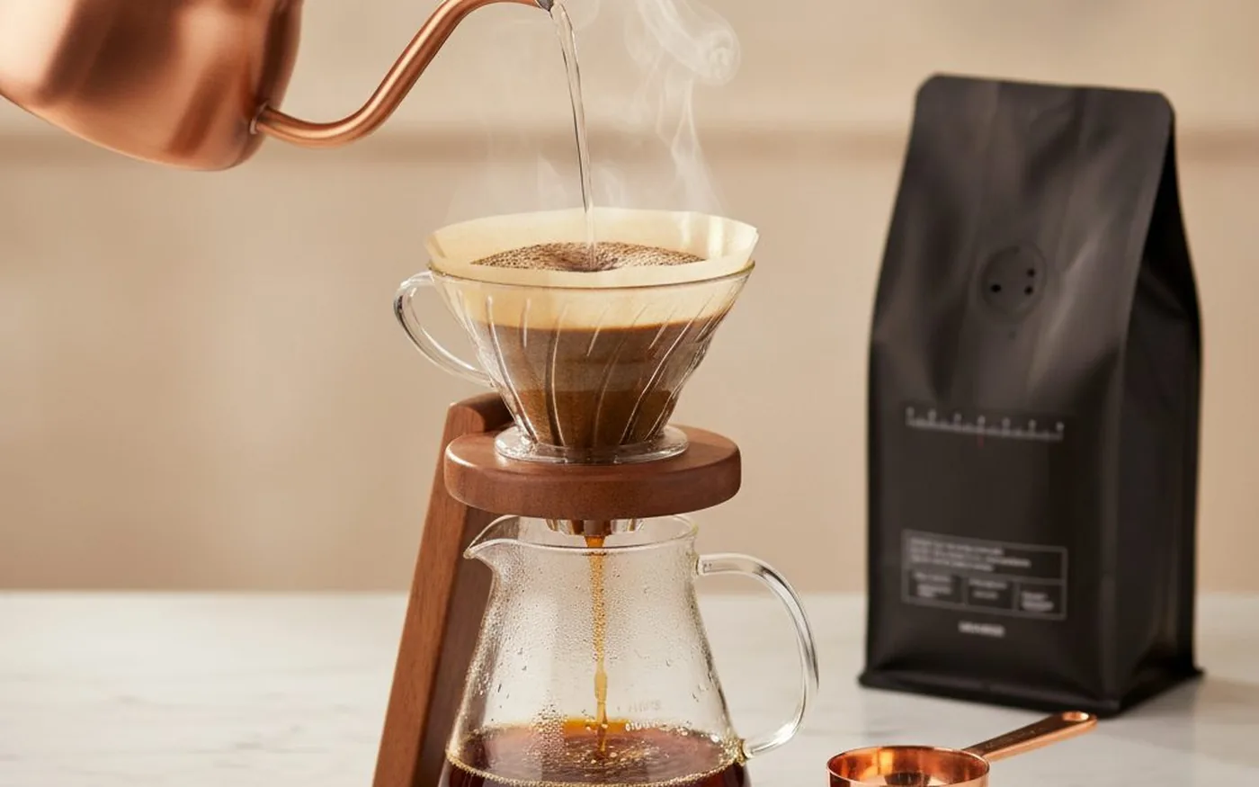 V60 pour-over filter coffee brewing on marble countertop