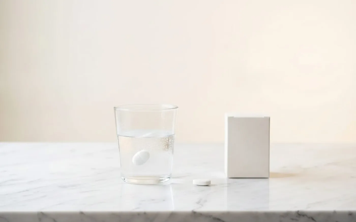 Magnesium supplement tablet dissolving in a glass of water showing absorption