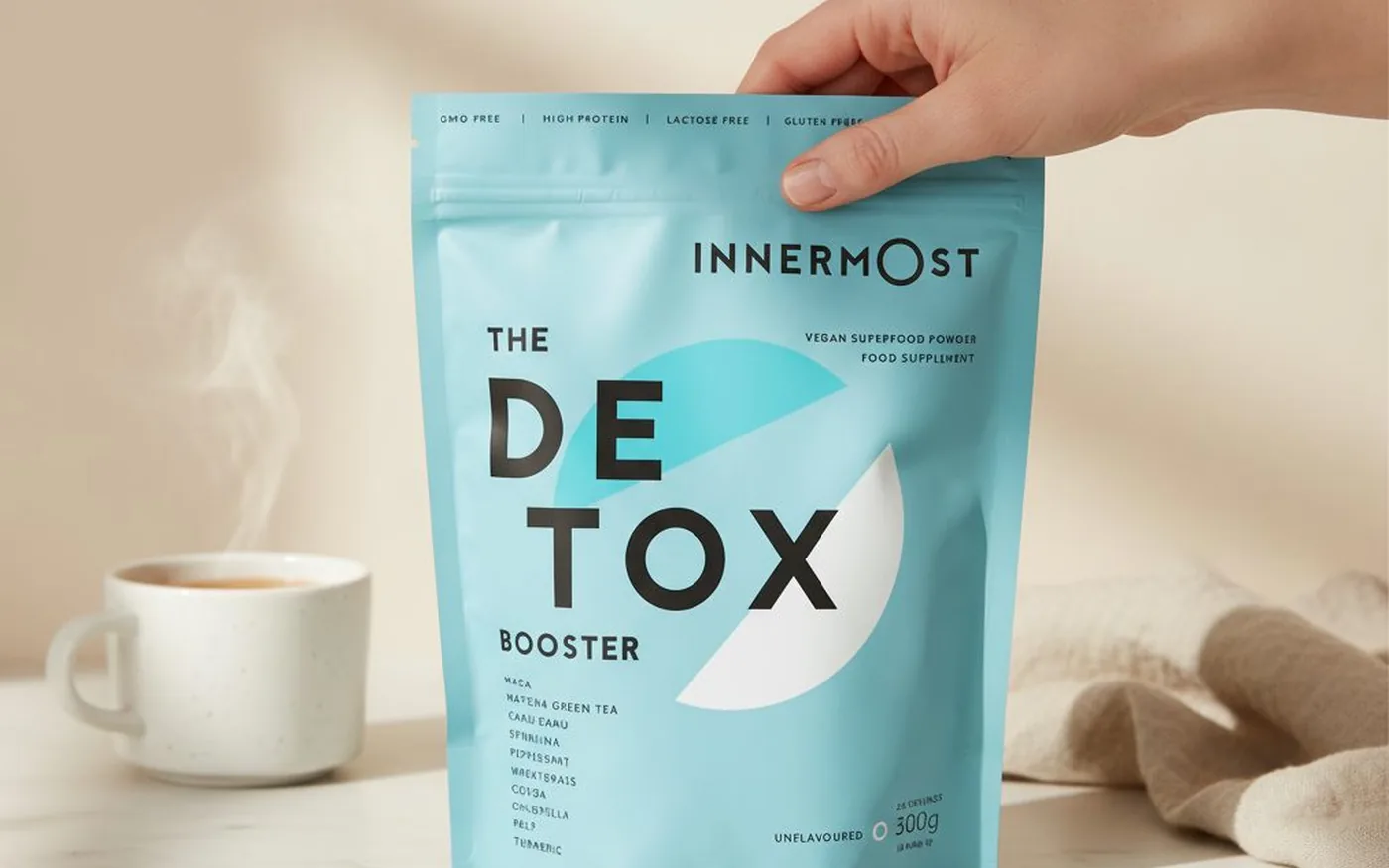 Innermost The Detox Booster supplement pouch on white marble countertop with natural lighting