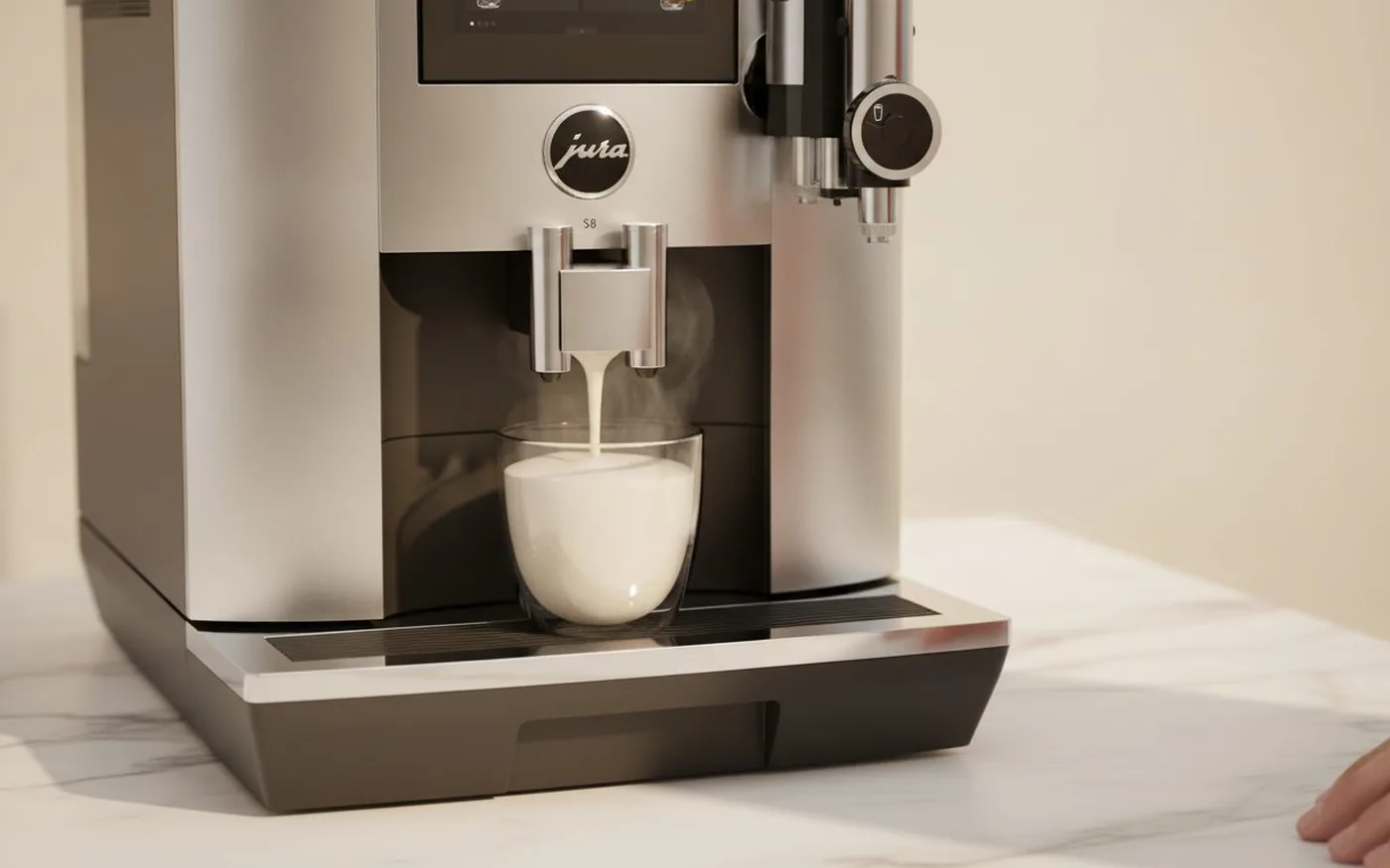 Jura S8 Professional Fine Foam frother with chrome nozzle and round selector switch texturing milk into a cup