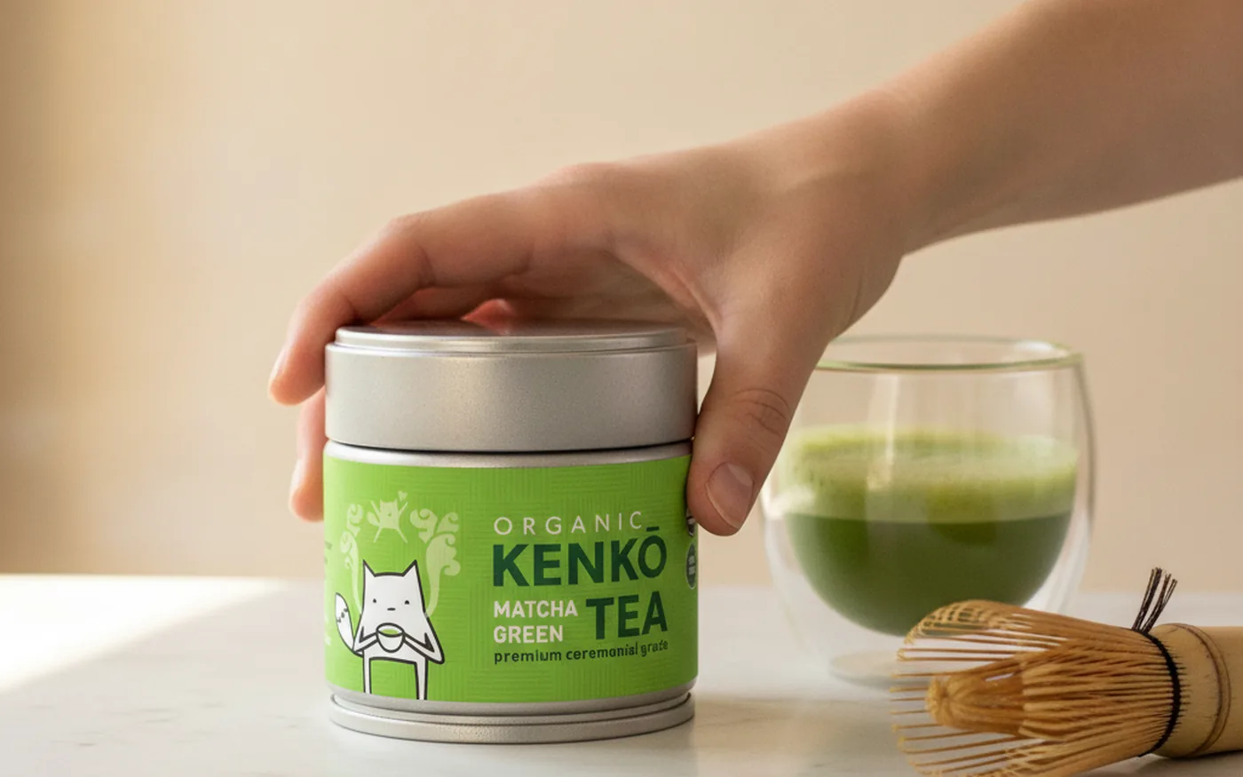 Kenko ceremonial matcha tin - small round silver aluminium tin with bright green label and fox mascot