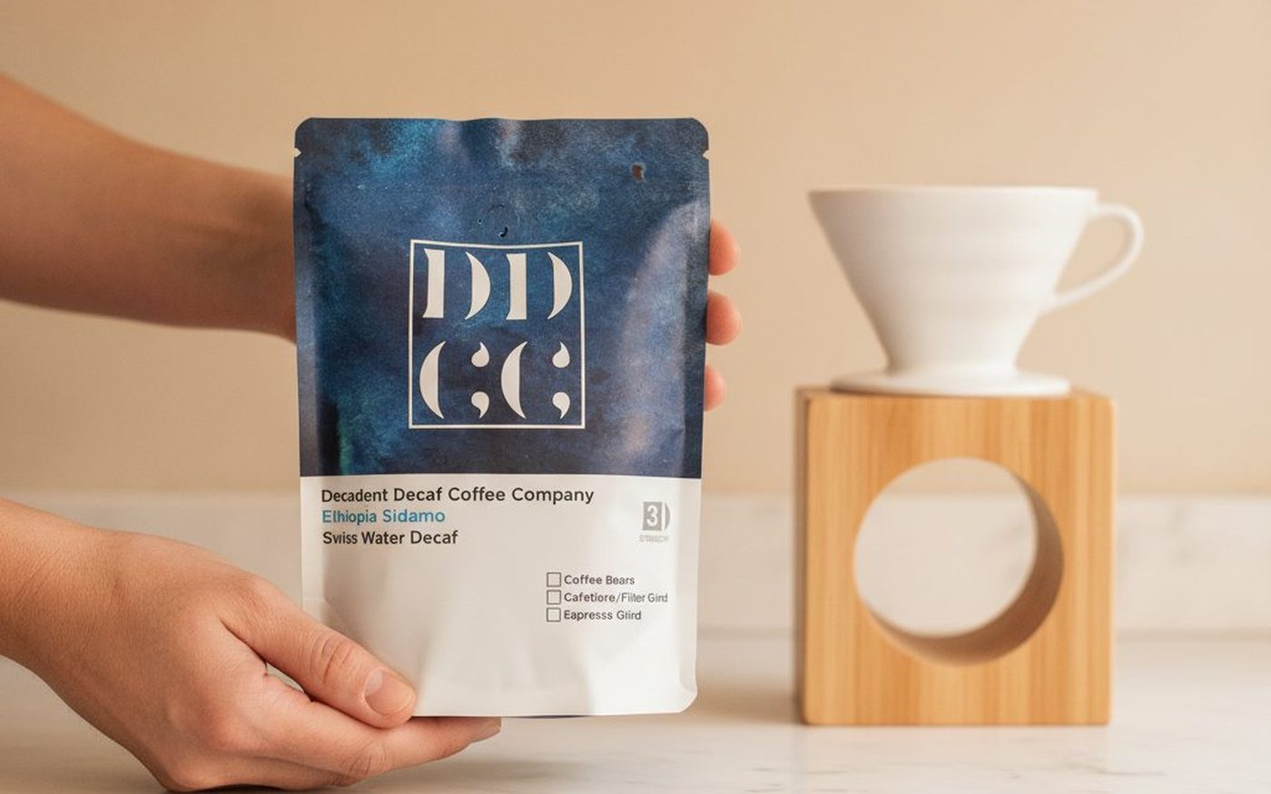 Decadent Decaf Coffee Company bag on white marble