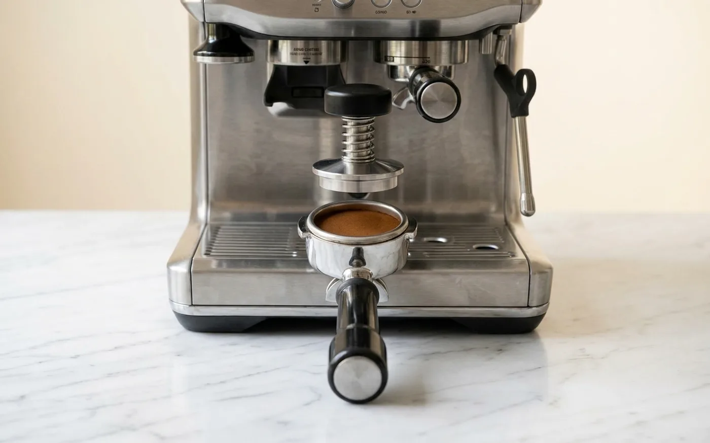 Sage Barista Express Impress tamp mechanism integrated into machine