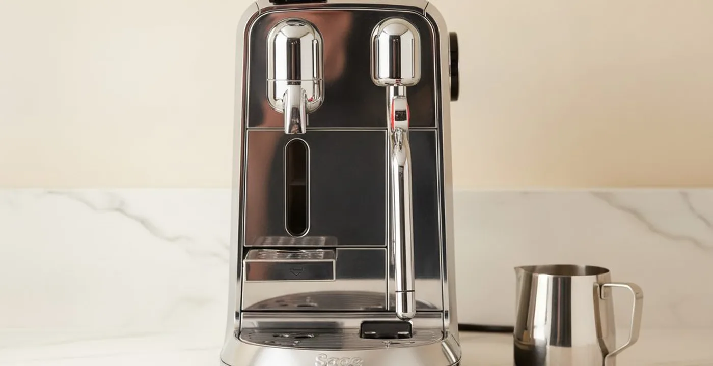 Sage Creatista Plus espresso machine with steam wand on kitchen counter
