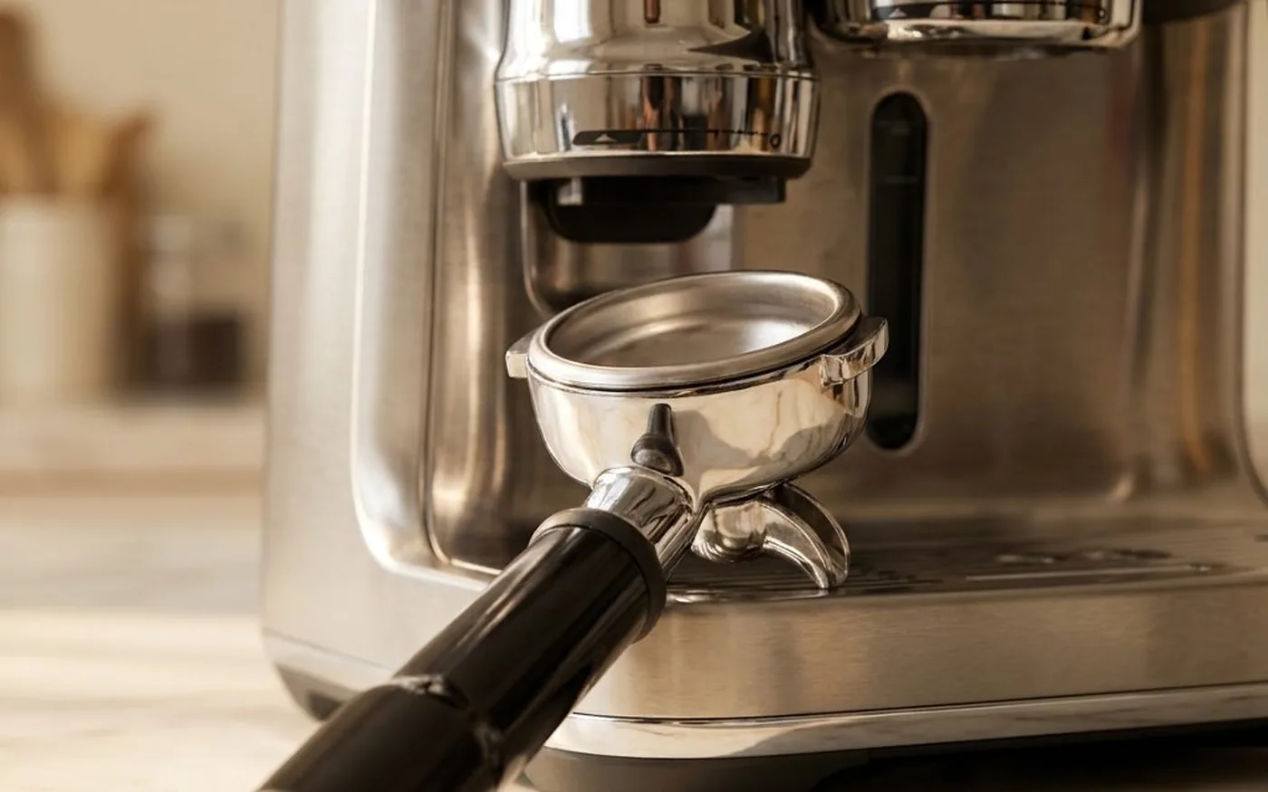 Sage Oracle Jet portafilter and auto-tamp mechanism close-up detail