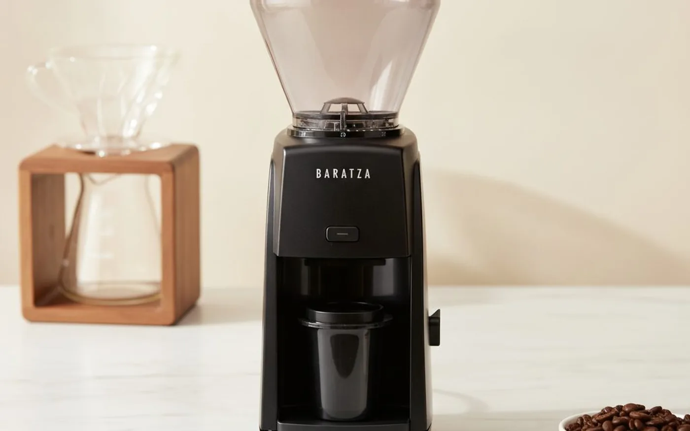 Baratza Encore coffee grinder on white marble with V60 dripper