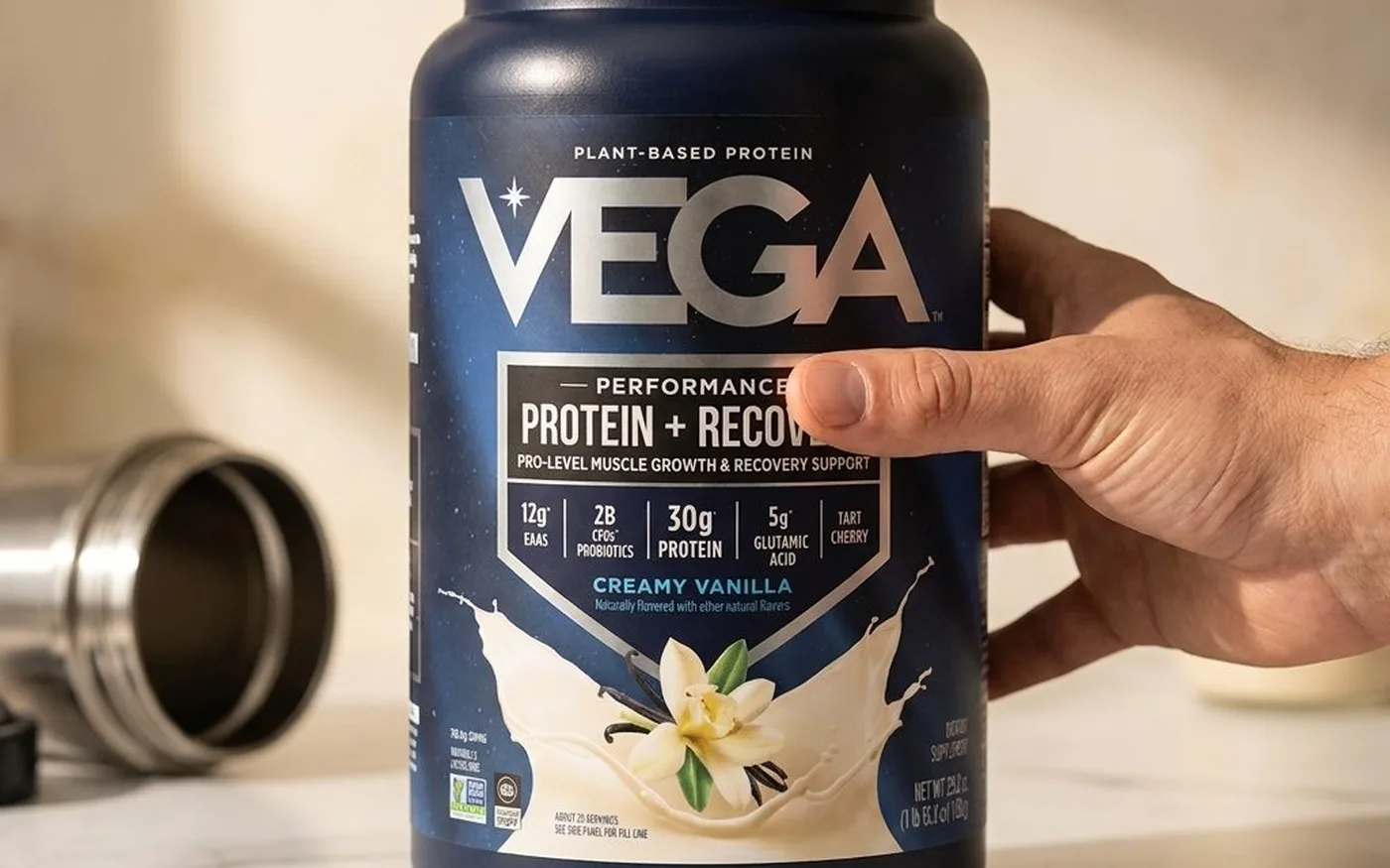 Vega Sport Premium Protein powder in a glass with water