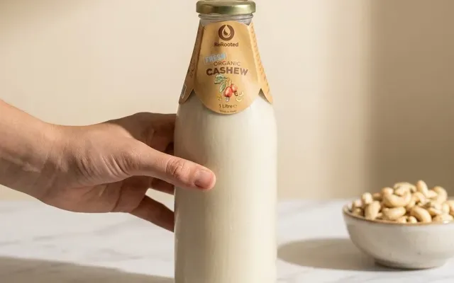 ReRooted organic cashew milk in a glass bottle