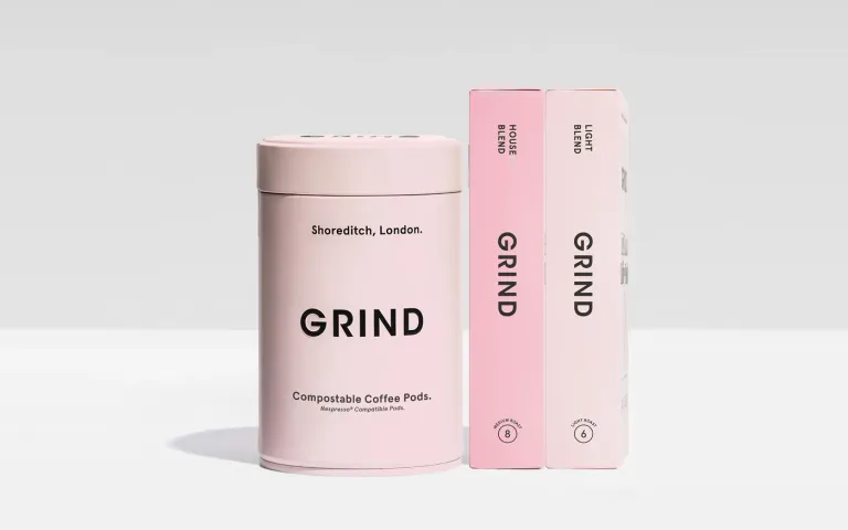 Grind compostable coffee pods tin with House Blend and Light Blend pod boxes
