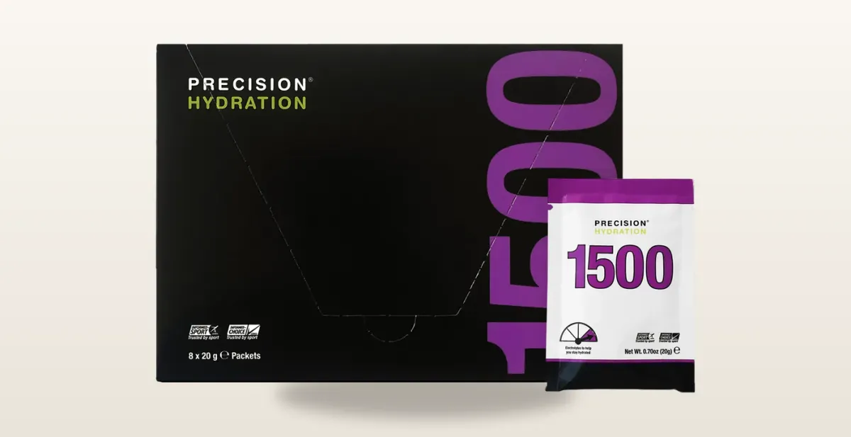 Precision Hydration electrolyte tablets and packaging on a running surface